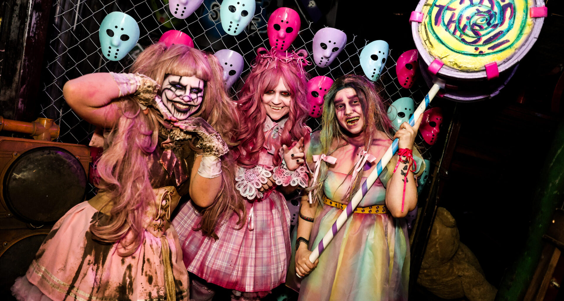 Colorful costumes in a spooky setting.